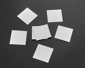 Mock-up of the two square business cards are on a black paper