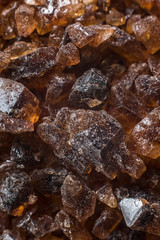 Amber mineral texture as natural background. Sun stones of different sizes, shapes and colors. A lot of big and small diggers. Fossil resin of wood. Material for jewelry. Depth of field, macro stone