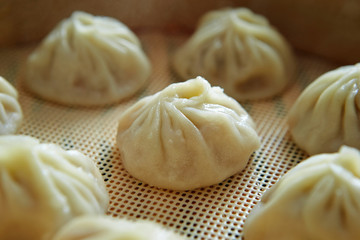 Fototapeta na wymiar Xiaolongbao, Chinese steamed buns in steamer