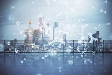 Technology theme hologram with city view from roof background. Double exposure.