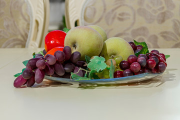 Home still life with fruits, flowers and kitchenware. Home decoration, still life in the apartment....