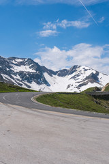 Fototapeta premium Mountain pass Fuscher Torl, view point on Grossglockner High Alpine Road, Austria. Sunny summer day, snowy peaks, top mountains, vertical photo
