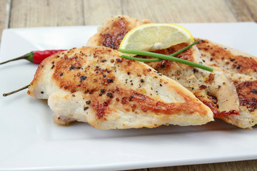grilled chicken cutlets on a plate