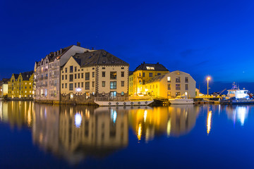 Fototapeta na wymiar Architecture of Alesund city reflected in the water, Norway