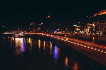 Fototapeta na wymiar 13.07.2018 Tbilisi, Georgia: view of the cultural Georgian night city of Tbilisi with its central square, tourists and night lights