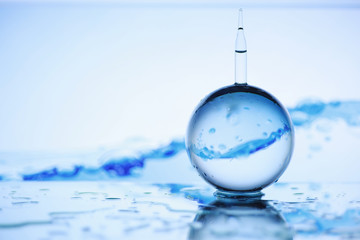 Tools for vision correction. Glasses and lenses with diopters on the background of splashes and...