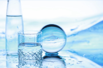 Tools for vision correction. Glasses and lenses with diopters on the background of splashes and...