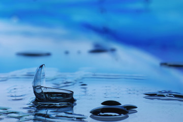 Tools for vision correction. Glasses and lenses with diopters on the background of splashes and...