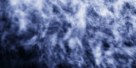 A stream of water and a cloud of drops