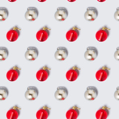 Merry Christmas and New Year seamless pattern. rhythmic ornament of silver and red shiny balls of Christmas decorations. Packaging concept, background, ornament