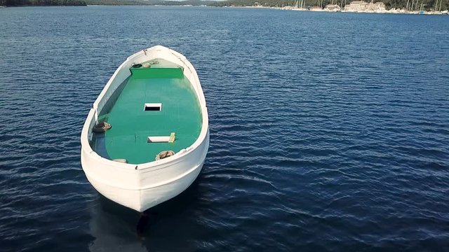 Aerial view of unfinished boat anchored alone at Adriatic sea, Croatia.