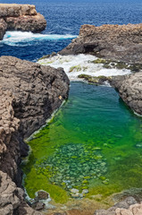 Fototapeta na wymiar Buracona, a small rocky bay in the northwest of the island of Sal, Cape Verde
