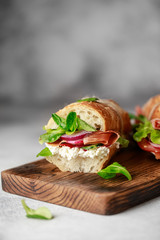 Fresh sandwich with tomatoes, jamon, corn salad and philadelphia cheese