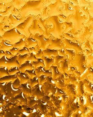 Drops of water on a gold background