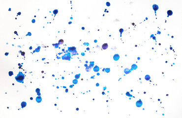 Multi-colored splashes of watercolor paints on white paper. Abstract winter background