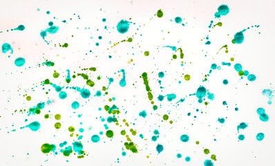 Multi-colored splashes of watercolor paints on white paper. Abstract spring background