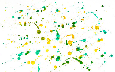 Multi-colored splashes of watercolor paints on white paper. Abstract spring background