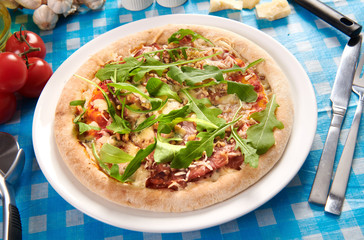 Pizza with prosciutto ham, walnuts, gorgonzola cheese and walnuts