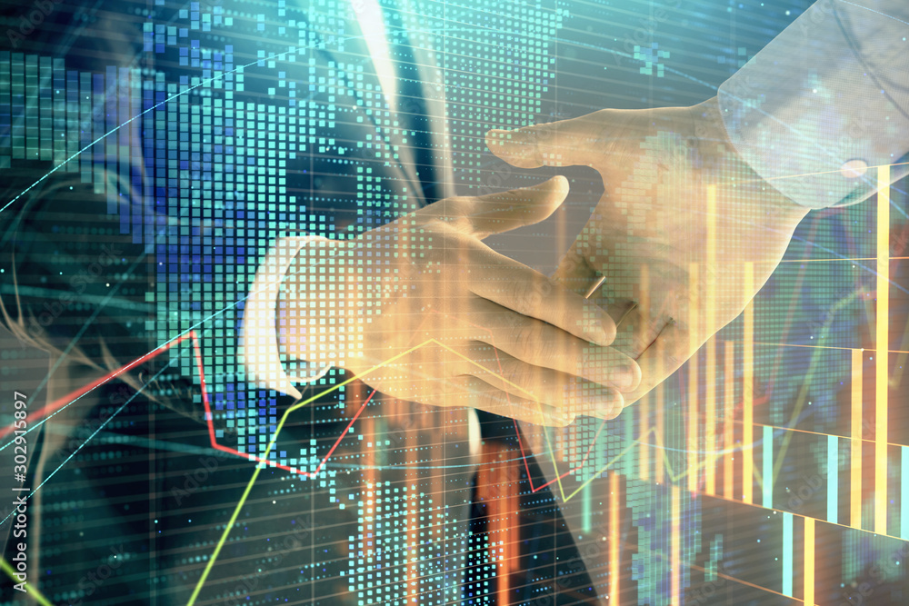Poster multi exposure of forex graph and world map on abstract background with two businessmen handshake. c
