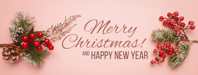 New Year and Christmas decor isolated on a pink background. Red balls, christmas tree and cones.