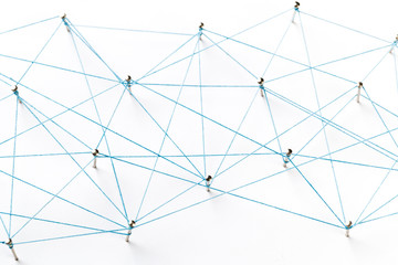 Communication, technology, network concept. Network with pinsA large grid of pins connected with string. Communication, technology, network concept. Network with pins