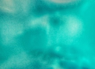 Colored water in a clear glass bottle