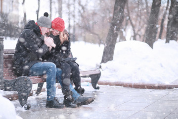 Young couple walking through the winter