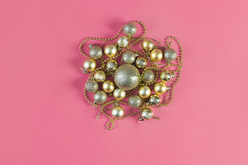 Christmas background with Xmas toys on pink canvas background. Happy New Year. Copy space.