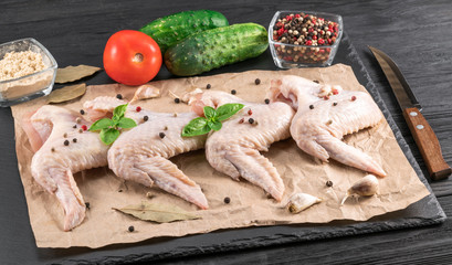 chicken wings on a black wooden background