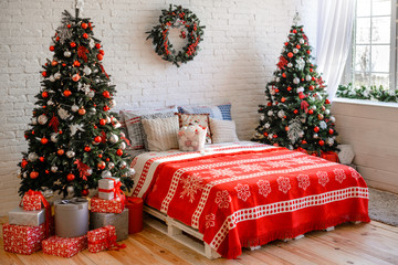 Beautiful holiday decorated room with Christmas tree with presents under it