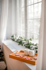 Beautiful holiday decorated room with Christmas tree with presents under it