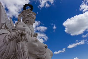 statue of lion and greek god in Lissabon