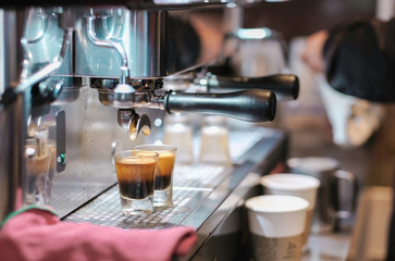 Close-Up Of Hand Pouring Coffee In Cafe