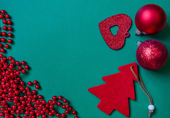 Christmas  tree  red decorations on a green background. place for text. view from above. flat lay