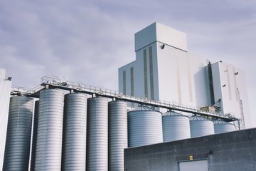silos in front of blue sky