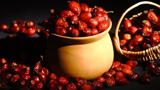 Detail macro view of dog rose hips in bowl latin name Fructus cynosbati . Dried rose hips are important source of vitamins in alternative medicine.