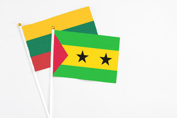 Sao Tome And Principe and Lithuania stick flags on white background. High quality fabric, miniature national flag. Peaceful global concept.White floor for copy space.