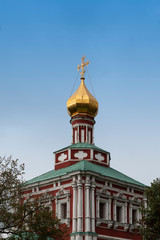 Fototapeta na wymiar Golden Tower on a Church