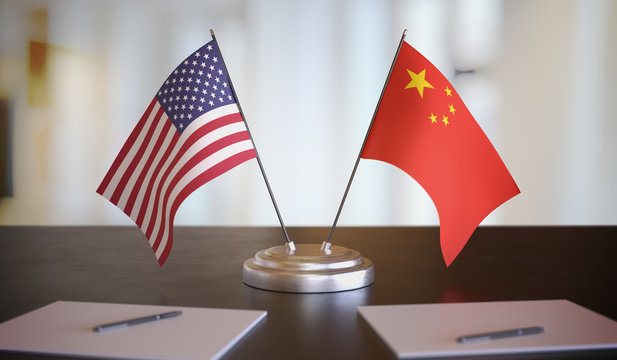 USA and Chinese flags on table. Negotiation between China and United states. 3D rendered illustration.
