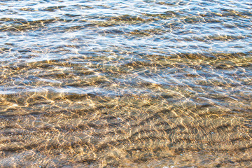 The water is clear and beautiful, the surface reflects sunlight.