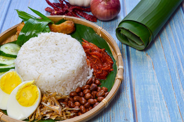 Nasi Lemak is commonly found food in Malaysia, Brunei and Singapore. It is an unofficial national food in Malaysia. Selective focus.