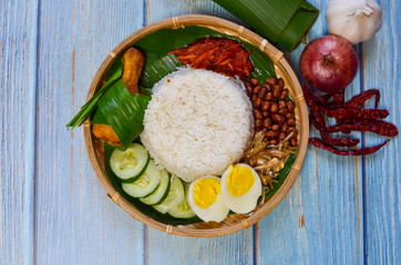 Nasi Lemak is commonly found food in Malaysia, Brunei and Singapore. It is an unofficial national food in Malaysia. Selective focus.