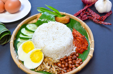 Nasi Lemak is commonly found food in Malaysia, Brunei and Singapore. It is an unofficial national food in Malaysia. Selective focus.