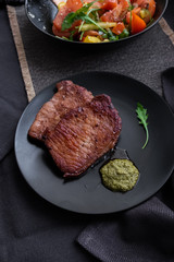 fried meat with raw vegetables. food photo. Delicious dinner