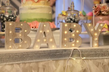 Decorative wooden letters BABY with lights for baby shower celebration
