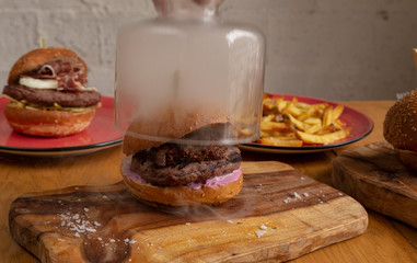 Delicious homemade smoked hunger with wood chips from Jack Daniel's, shredded BBQ pork and American...