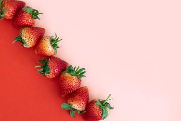 Minimal Strawberries on red and pink background