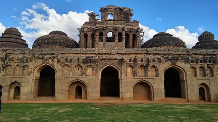 Fototapeta na wymiar Elephant Stables , Hampi , India . Beautiful architecture , remains of royal elephant stables . Indo - Islamic style