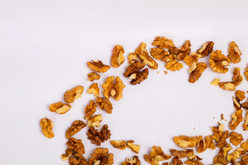Shredded walnuts on a white background. Useful snack.