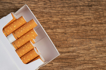 peel it off Cigarette pack prepare smoking a cigarette on the wooden. Packing line up. photo filters Natural light. soft focus. Leave space to write a description of the message.